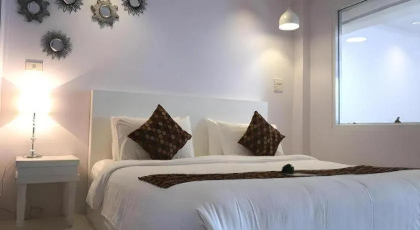Bed in NanNakara Boutique Hotel