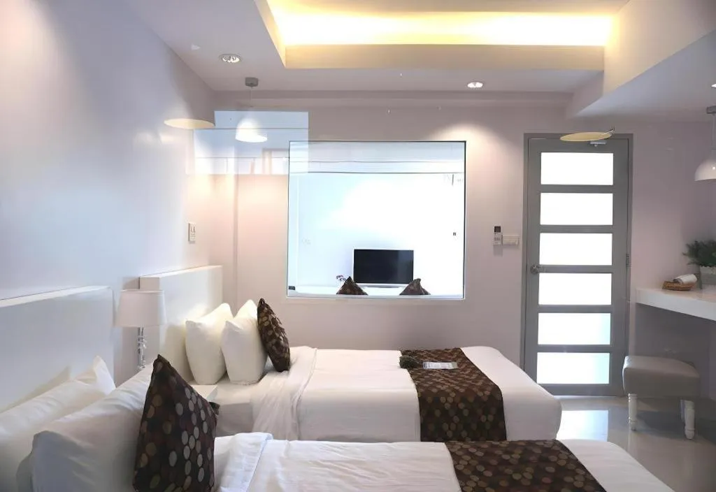 Bed in NanNakara Boutique Hotel