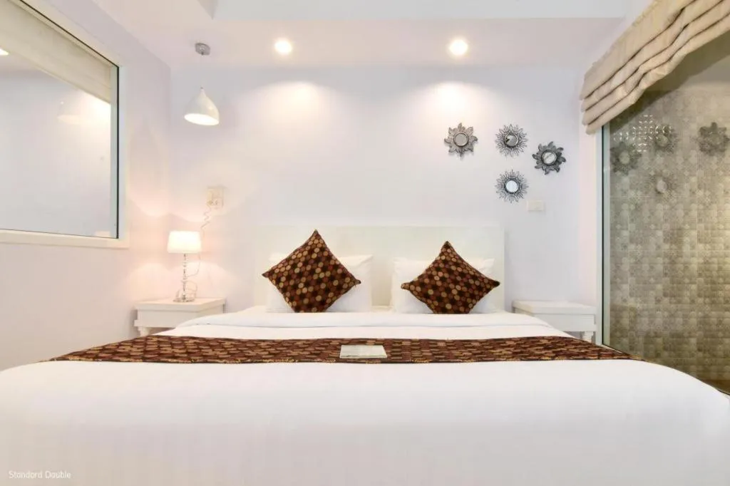 Bed in NanNakara Boutique Hotel