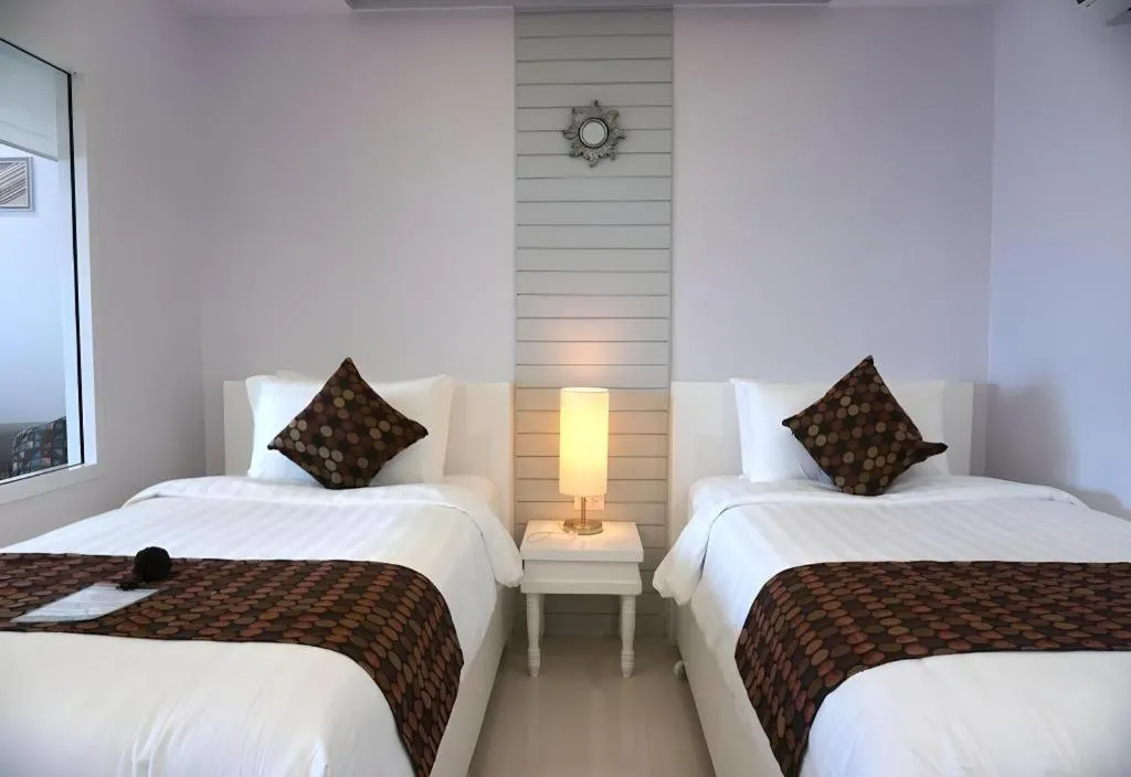 Bed in NanNakara Boutique Hotel
