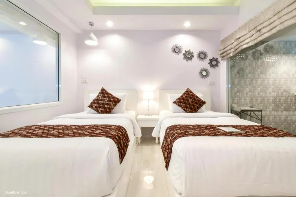 Bed in NanNakara Boutique Hotel
