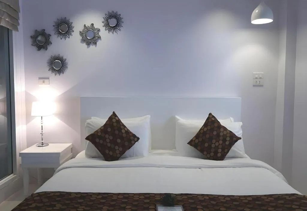 Bed in NanNakara Boutique Hotel