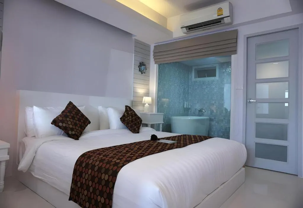 Bed in NanNakara Boutique Hotel