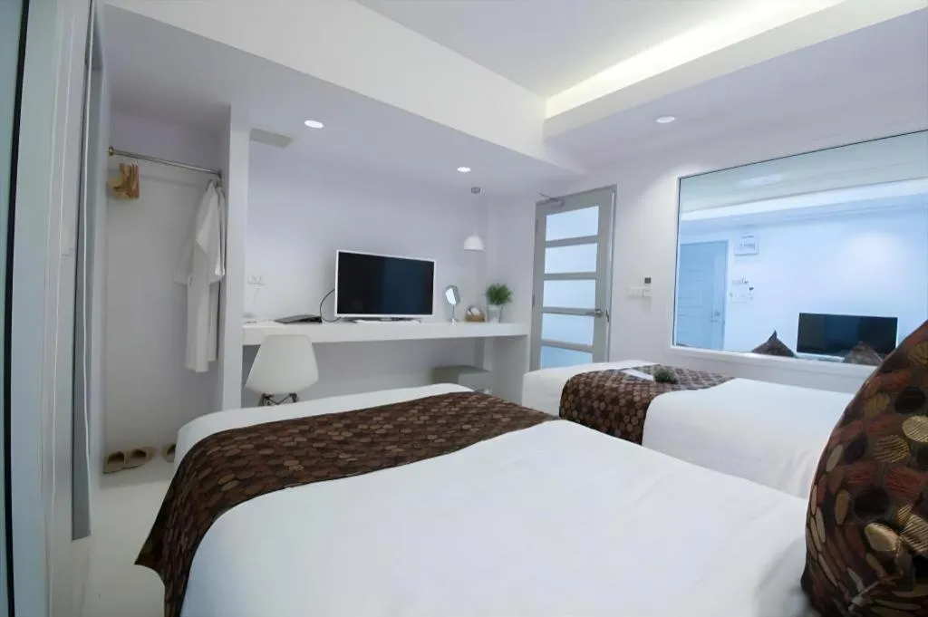 Bed in NanNakara Boutique Hotel