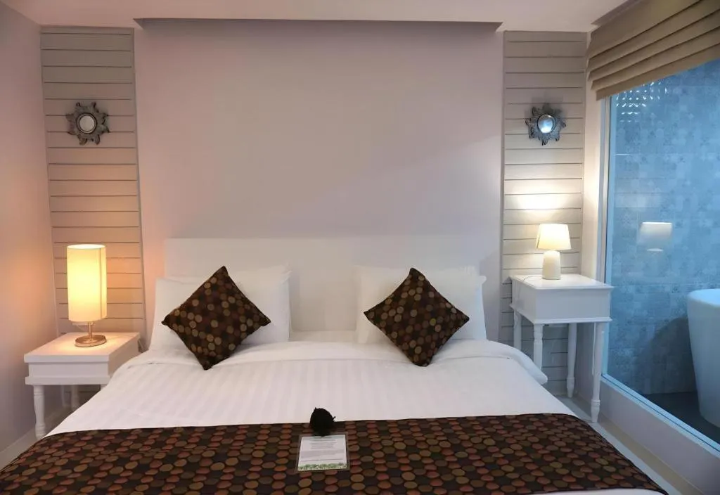 Bed in NanNakara Boutique Hotel