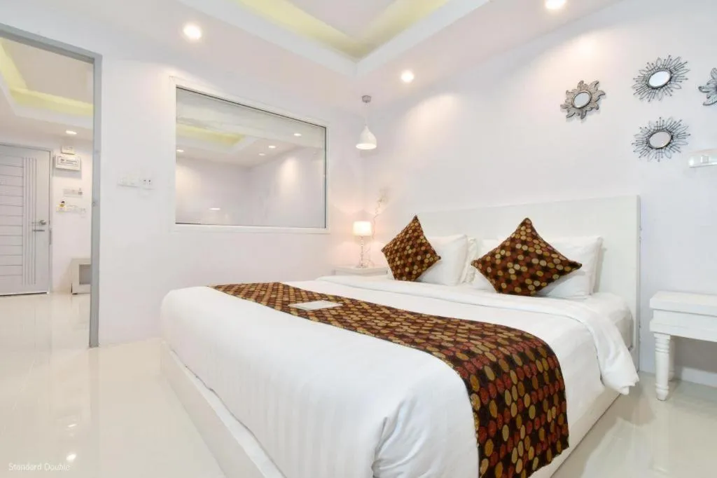 Bed in NanNakara Boutique Hotel