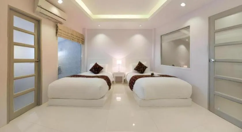 Bed in NanNakara Boutique Hotel