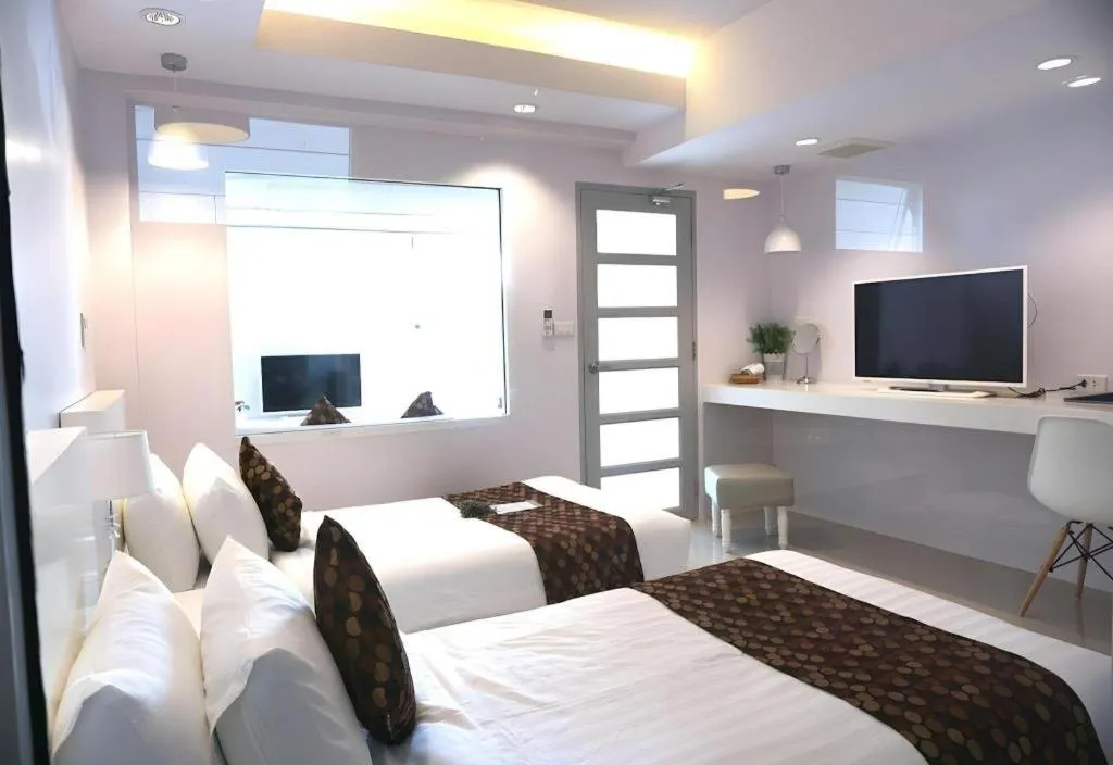 Bed in NanNakara Boutique Hotel