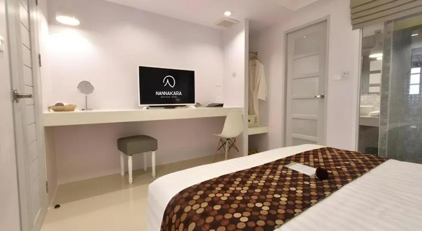 Bed in NanNakara Boutique Hotel