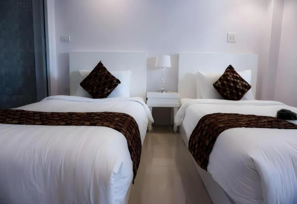Bed in NanNakara Boutique Hotel