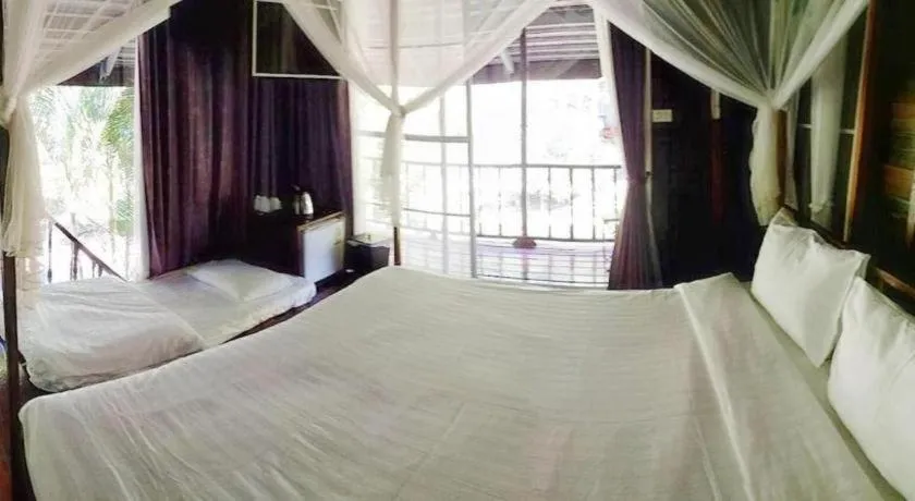 Bed in The White House Boutique Resort