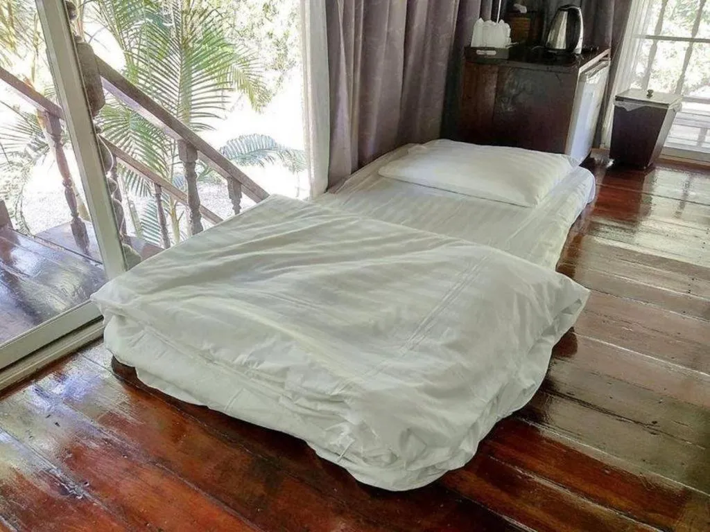 Bed in The White House Boutique Resort
