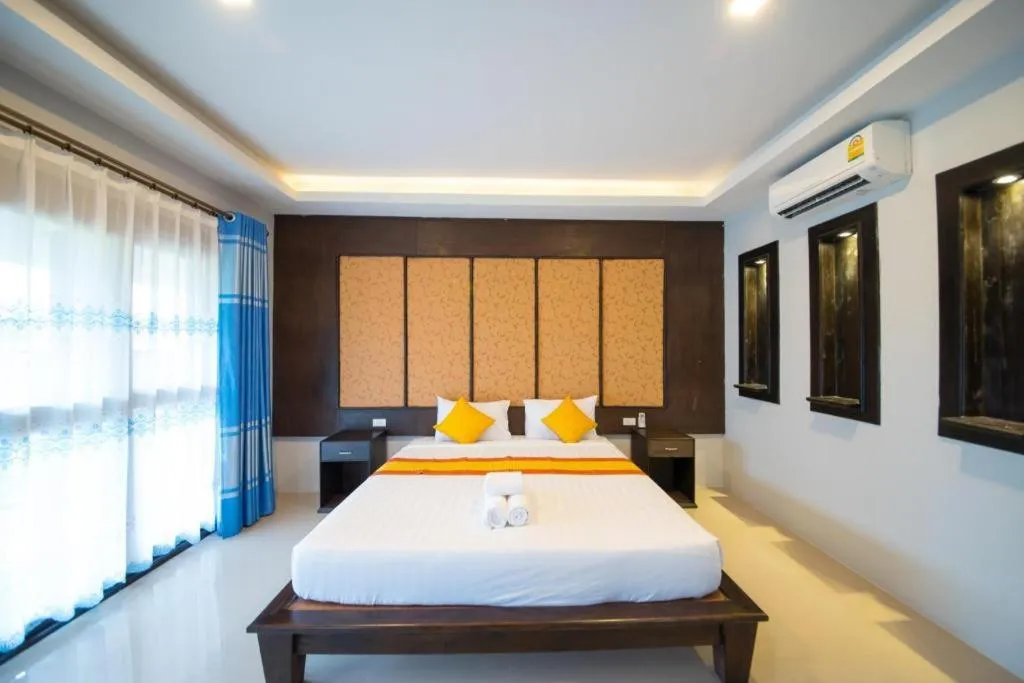 Bed in Poochommhok Resort