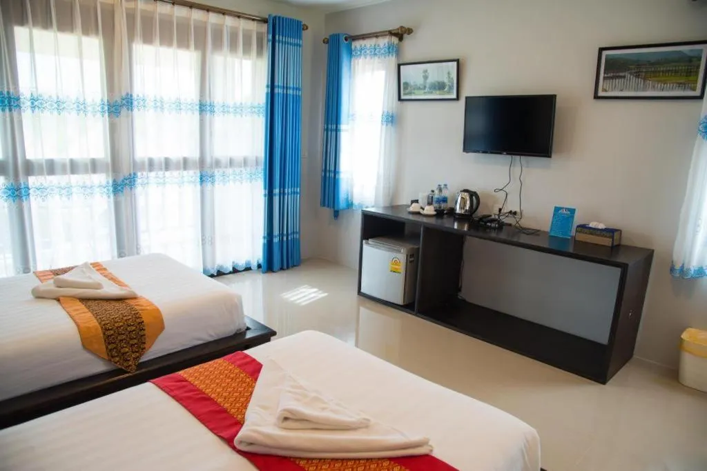 Bed in Poochommhok Resort