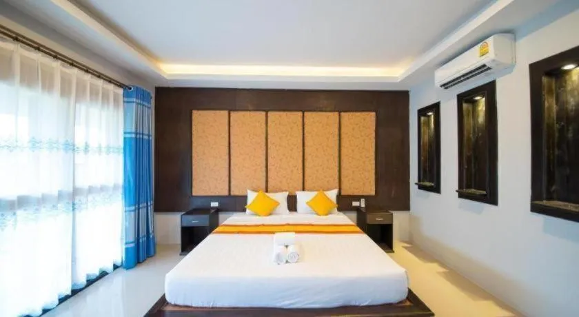 Bed in Poochommhok Resort