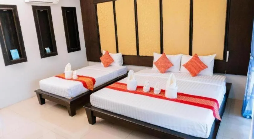 Bed in Poochommhok Resort