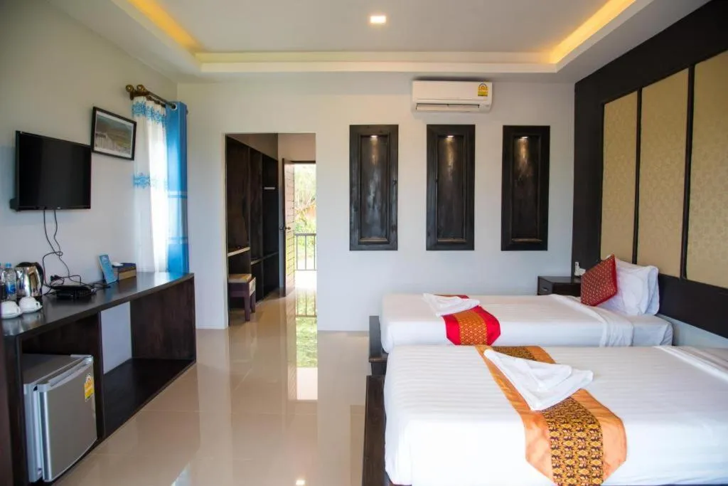 Bed in Poochommhok Resort