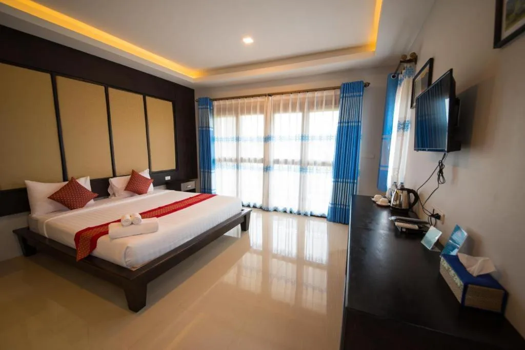 Bed in Poochommhok Resort