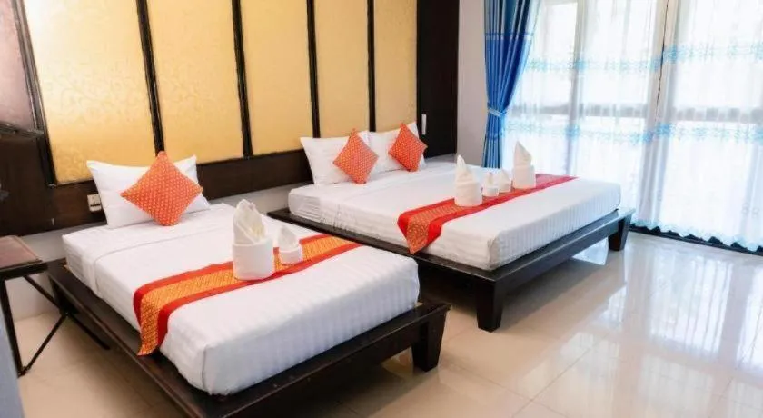 Bed in Poochommhok Resort