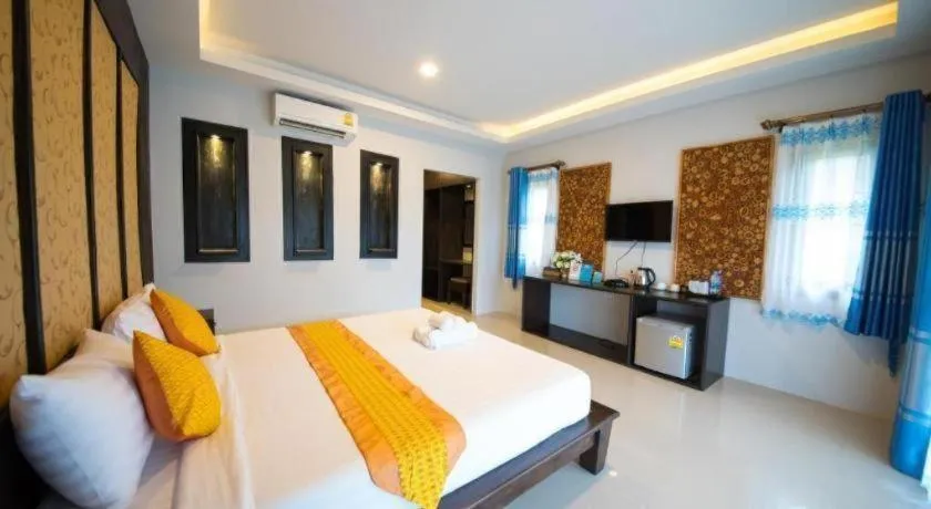 Bed in Poochommhok Resort