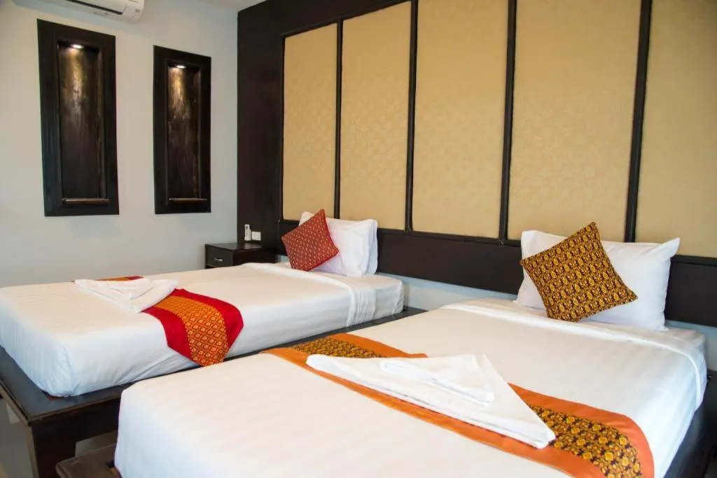 Bed in Poochommhok Resort