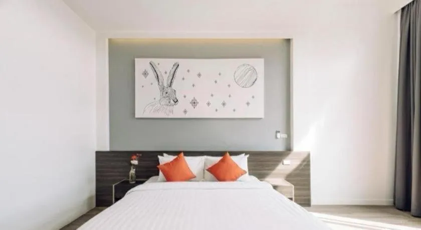 Bed in PIMDARA HOTEL