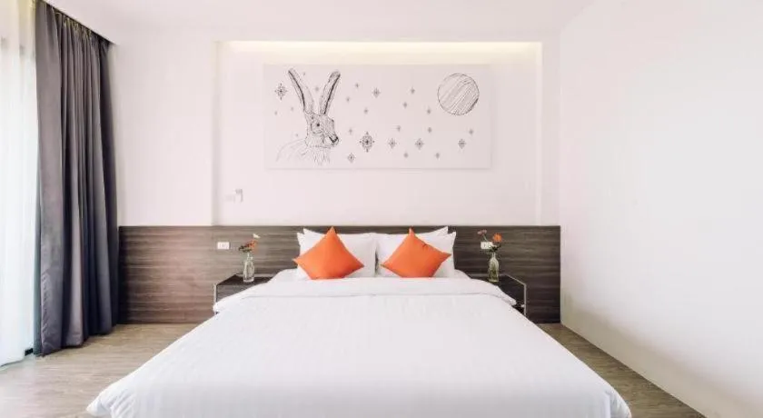 Bed in PIMDARA HOTEL