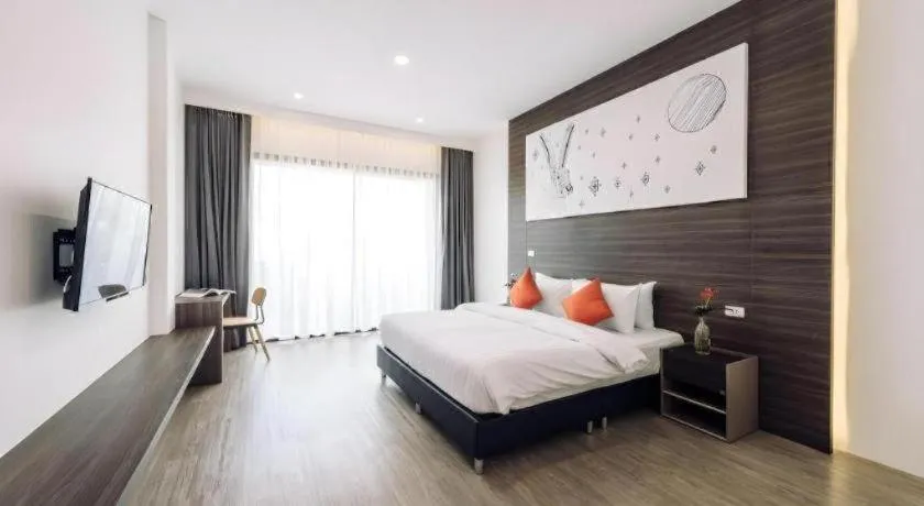 Bed in PIMDARA HOTEL