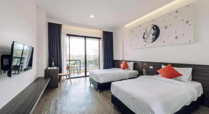 Bed in PIMDARA HOTEL