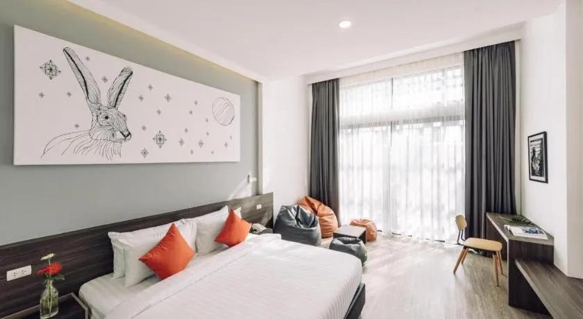 Bed in PIMDARA HOTEL