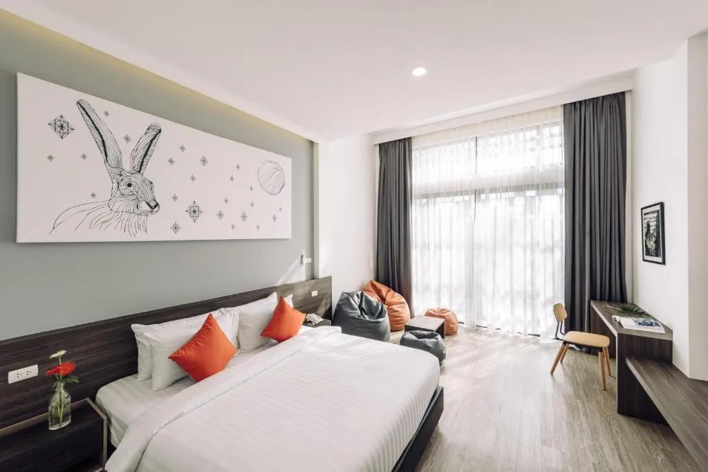 Bed in PIMDARA HOTEL