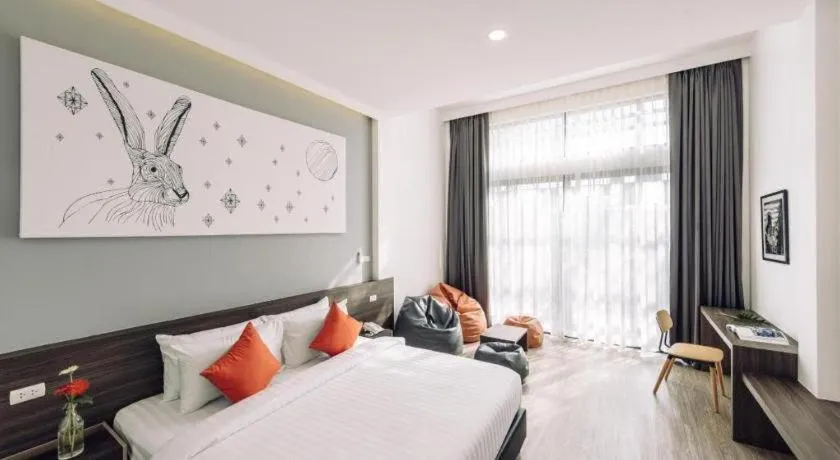 Bed in PIMDARA HOTEL