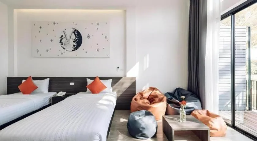 Bed in PIMDARA HOTEL