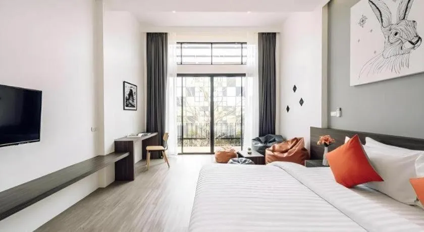 Bed in PIMDARA HOTEL