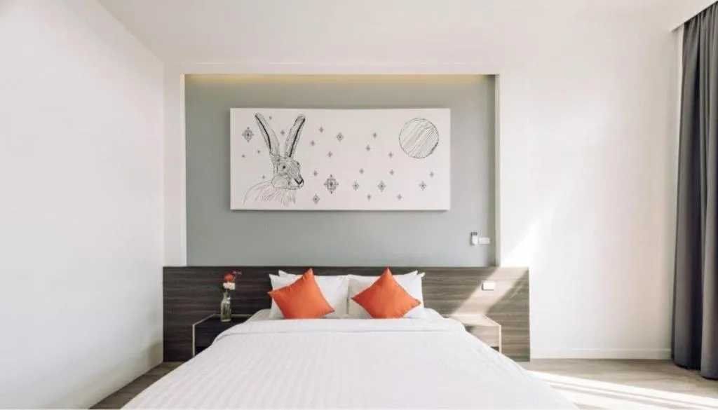 Bed in PIMDARA HOTEL