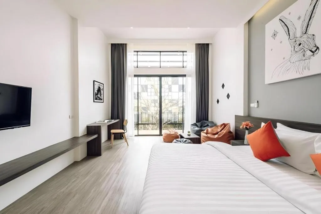 Bed in PIMDARA HOTEL