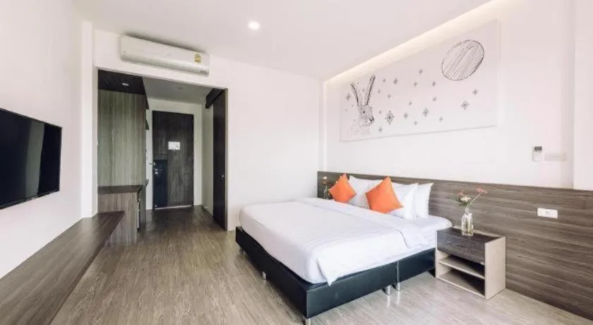 Bed in PIMDARA HOTEL