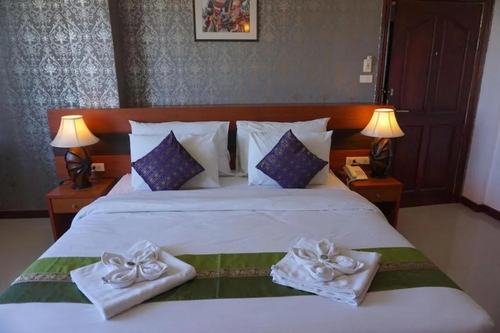 Bed in Sirimathani Hotel