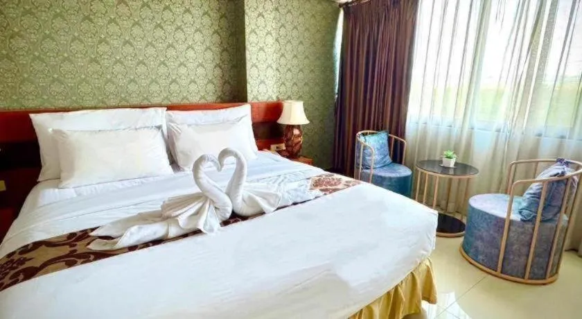 Bed in Sirimathani Hotel