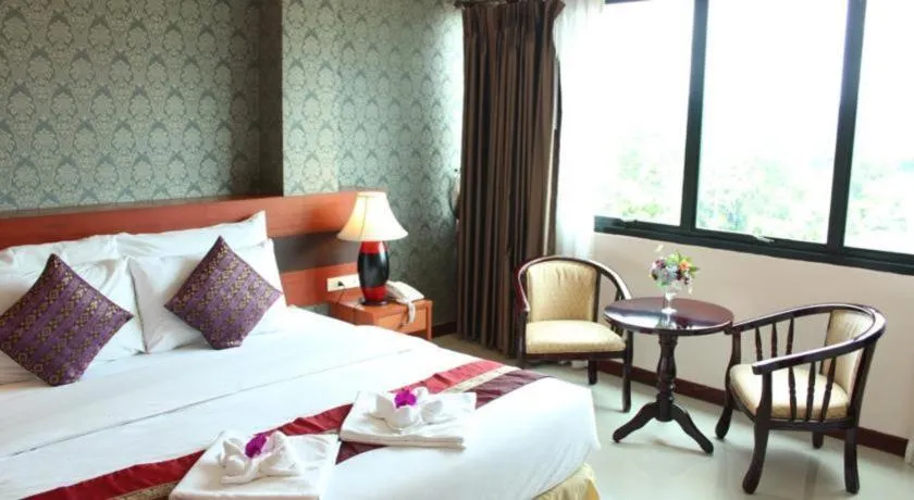 Bed in Sirimathani Hotel