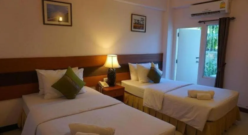 Bed in Sirimathani Hotel