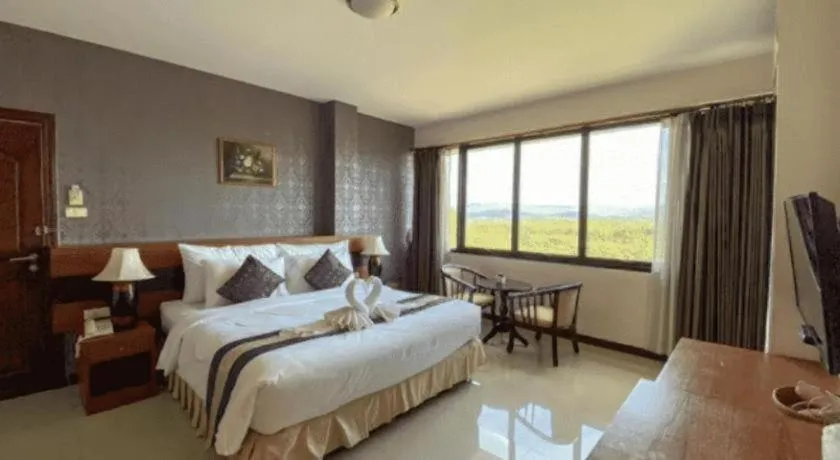 Bed in Sirimathani Hotel