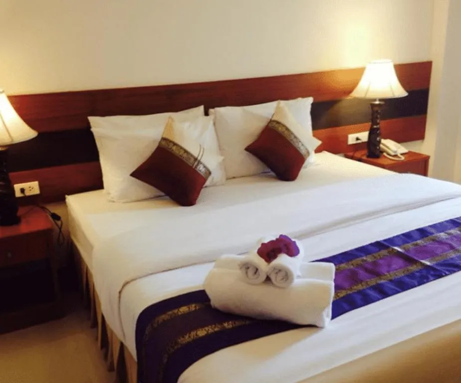 Bed in Sirimathani Hotel