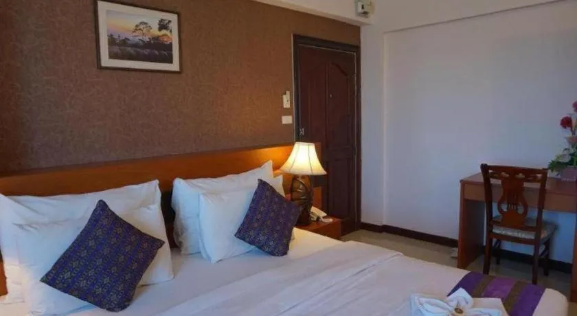 Bed in Sirimathani Hotel