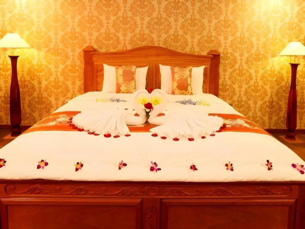 Bed in New Palace Bac Lieu Hotel