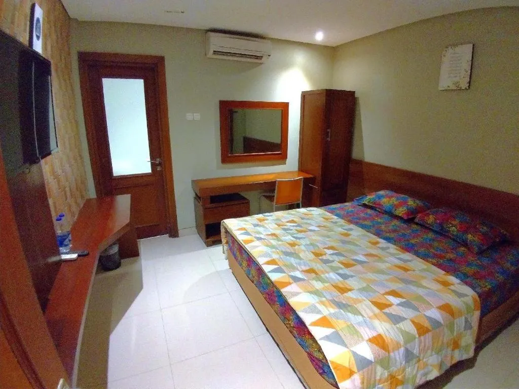 Bed in Hotel Adilla Syariah Ambarukmo