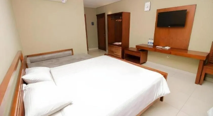 Bed in Hotel Adilla Syariah Ambarukmo