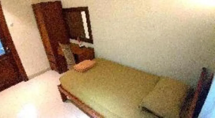 Bed in Hotel Adilla Syariah Ambarukmo