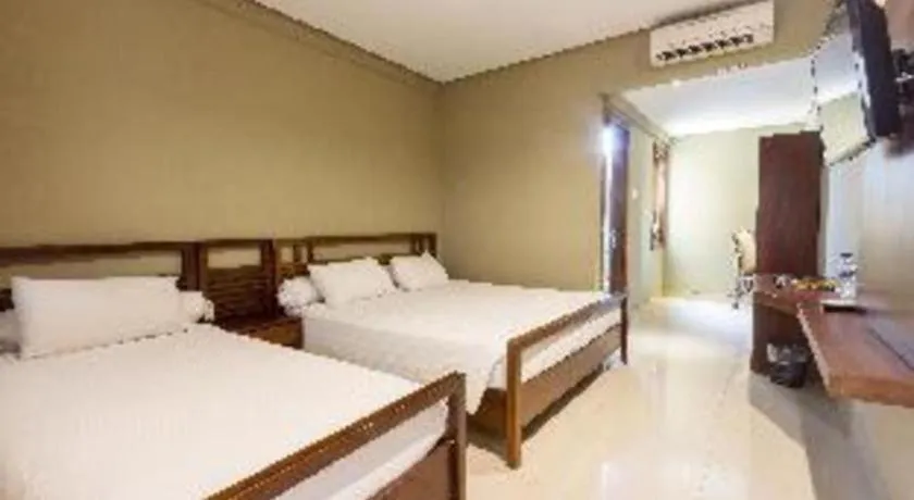 Bed in Hotel Adilla Syariah Ambarukmo