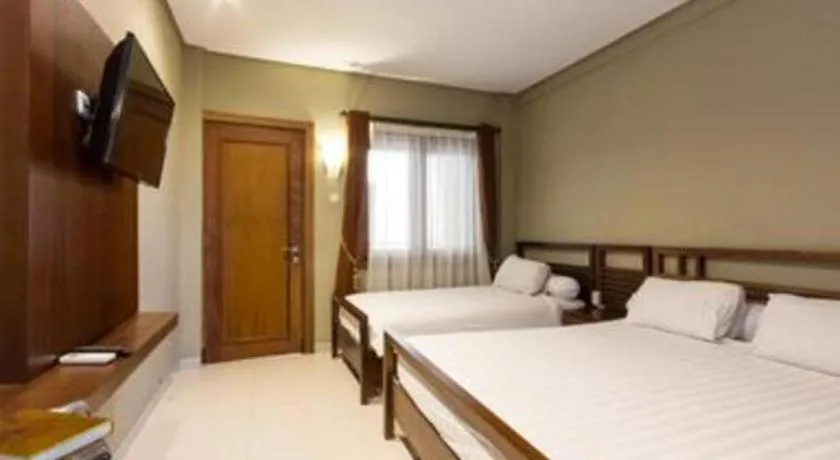 Bed in Hotel Adilla Syariah Ambarukmo